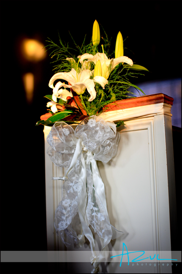 The First Presbyterian Church gets ready with flowers on the pews for a wedding in Wilson 