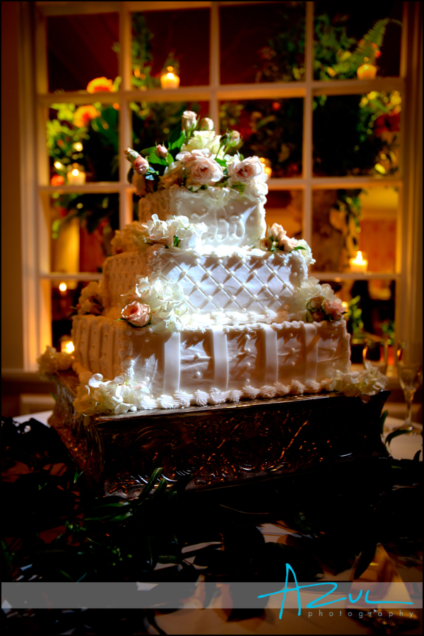 Flowers and cake wait for the couple after the ceremony at the country club.