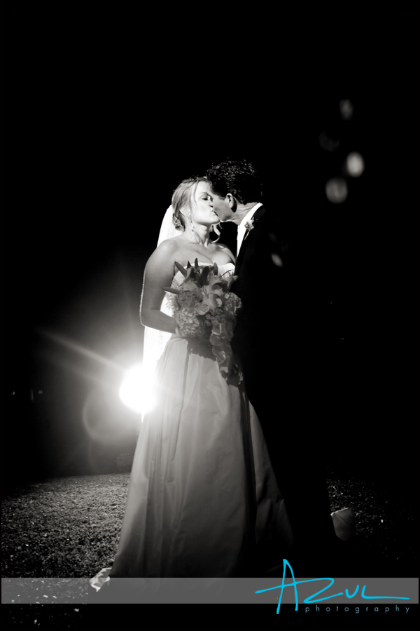 The couple enjoy a kiss as the night ends on the wedding day.